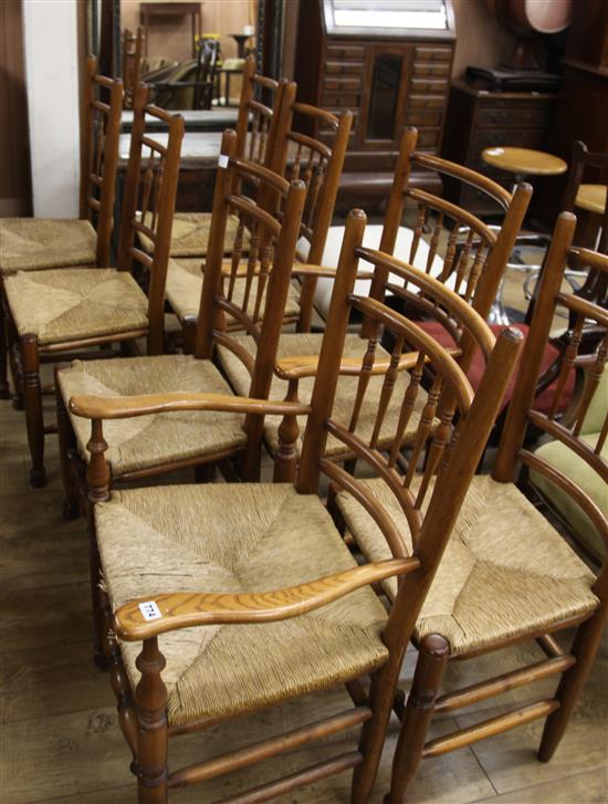 A set of 8 oak and ash spindle back rush seat chairs (6 + 2 carvers)